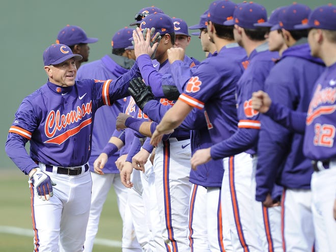 Former Clemson baseball coach Jack Leggett greets his players prior to a game this past season at Fluor Field in Greenville.