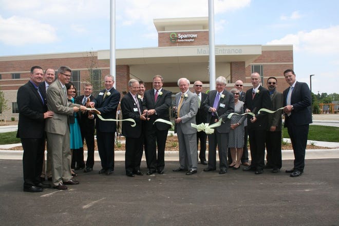 Hospital administrators, board members, and staff cut the ribbon for the new Sparrow Ionia Hospital. The hospital will open its doors officially on Sunday, June 14.