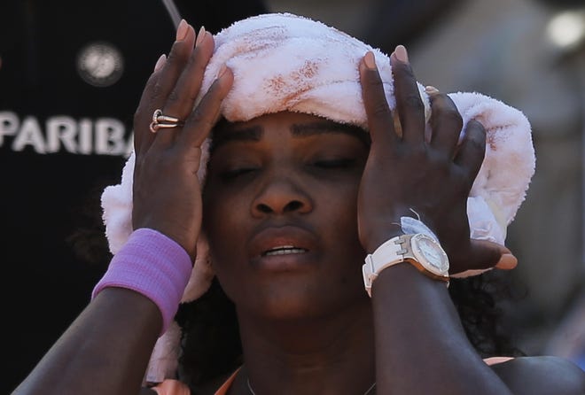 Serena Williams cools off in her semifinal match of the French Open tennis tournament against Timea Bacsinszky of Switzerland at the Roland Garros stadium, in Paris, France, Thursday, June 4, 2015.