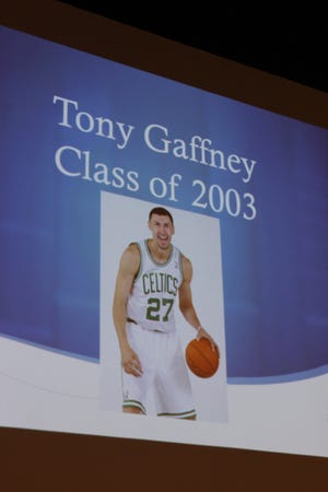 This photograph of Tony Gaffney was put on a screen in the performing arts center of Somerset Berkley Regional High School as a recording was played of him talking about being inducted into the school's Athletic Hall of Fame. Gaffney could not attend the ceremony because he is playing professional basketball in Israel.