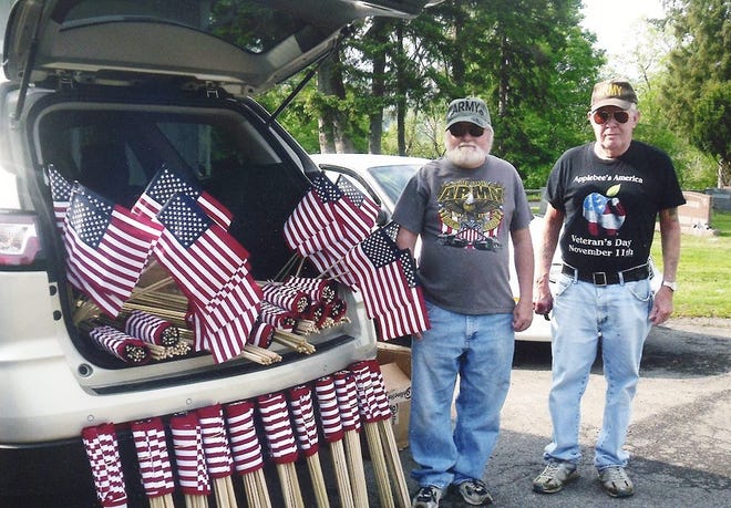Ron Schoonmaker, a Vietnam War veteran, is pictured on left with Roger Blum on May 16 at Oak Hill Cemetery. Schoonmaker led efforts to place American flags at the graves of all veterans in the Oak Hill and Calvary cemeteries before Memorial Day. SUMBITTED PHOTO