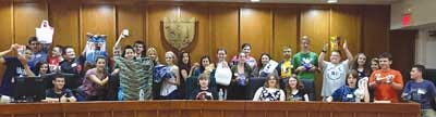 Submitted photo Sussex Middle School eighth-graders participating in the Youth in Government Program hold donations, including toys, blankets, pillows and food, for Wantage Township’s animal shelter.