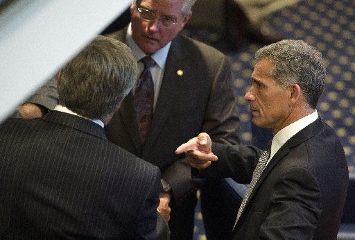 Office of Senate President Pro Tempore Del Marsh, right, points at another senator while talking on the Alabama Senate floor during the legislative session on Thursday, June 4, 2015, at the State House in Montgomery, Ala. (Albert Cesare/The Montgomery Advertiser via AP)