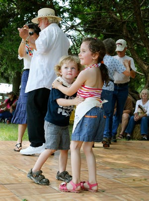 Landry Redding and Elena Bradley dance to the music of a Zydeco band during last year's Chisholm Trail & Crawfish Festival at the Kirkpatrick Family Farm in Yukon. [Photo by Paul Hellstern, The Oklahoman Archives]