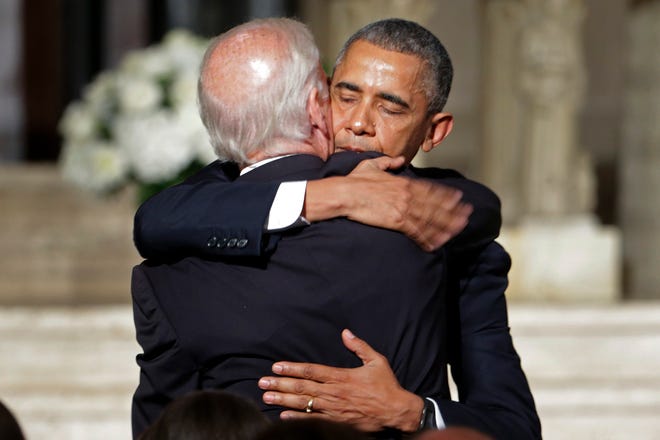 President Barack Obama hugs Vice President Joe Biden after delivering the eulogy in honor of Biden's son, former Delaware Attorney General Beau Biden on Saturday at St. Anthony of Padua Church in Wilmington, Del. Biden, Vice President Biden's eldest son, died at the age of 46 after a battle with brain cancer. AP Photo by Pablo Martinez Monsivais, Pool