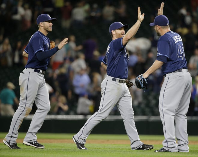 Tampa Bay Rays' Logan Forsythe greets closing pitcher Kevin Jepsen, right, after the Rays beat the Seattle Mariners 1-0 in a baseball game, Friday, June 5, 2015, in Seattle. Forsythe scored the only run in the game with a solo home run in the ninth inning.