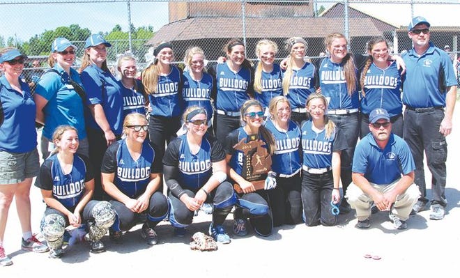 Members of the 2015 regional champion Inland Lakes varsity softball team include (back row, from left)) coach Krissi Thompson, athletic trainer Juliann Plimpton, assistant coach Nancy Wandrie, Brandi Bennett, Madison (Maddog) Milner, Fallyn Dunn, Vanessa Wandrie, Lindsay Van Daele, Makayla (Maki) Henkel, Cloe Mallory, Sydney (Syd) DePauw, assistant coach Dan Mallory (front row, from left), Pamela Braund, Sadie Bunker, Keahna DePauw, McKenzie Milner, Shianne Parrott, Kimmy (Rip City) Rorick, and coach Nate Thompson. The Bulldogs captured the first softball championship in Inland Lakes school history with a 4-1 victory over defending class D state champion Rogers City in the title game in Pellston on Saturday.