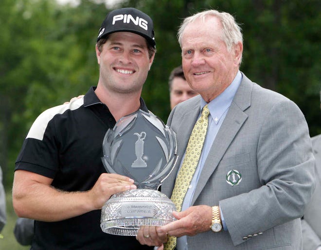Jack Nicklaus, right, presents David Lingmerth with the winner's trophy after Lingmerth won the Memorial golf tournament in a three-hole playoff on Sunday in Dublin, Ohio. (AP Photo/Jay LaPrete)