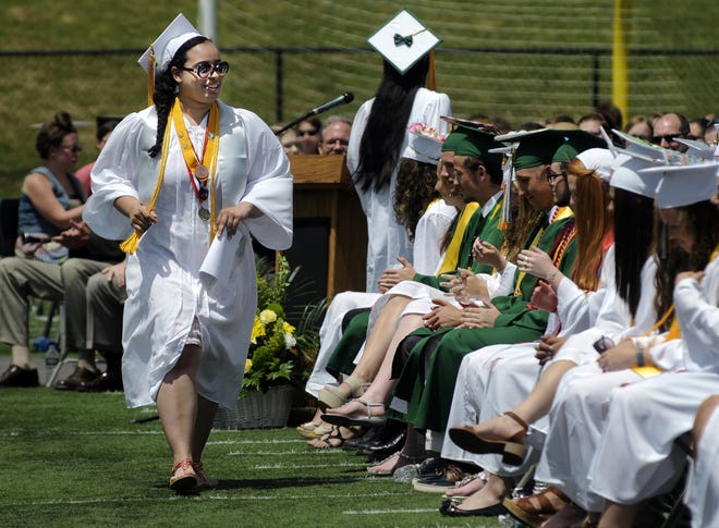 Salutatorian Julia Pena walks back to her seat after addressing graduates and guests during the Oakmont High School graduation in Ashburnham Sunday. T&G Photo/Christine Peterson