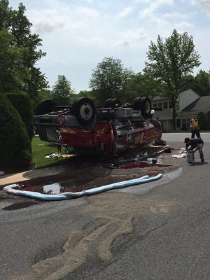 Police investigate an overturned tanker truck on Birchfield Drive in Mount Laurel on Monday, June 8, 2015. The truck was carrying home heating oil.