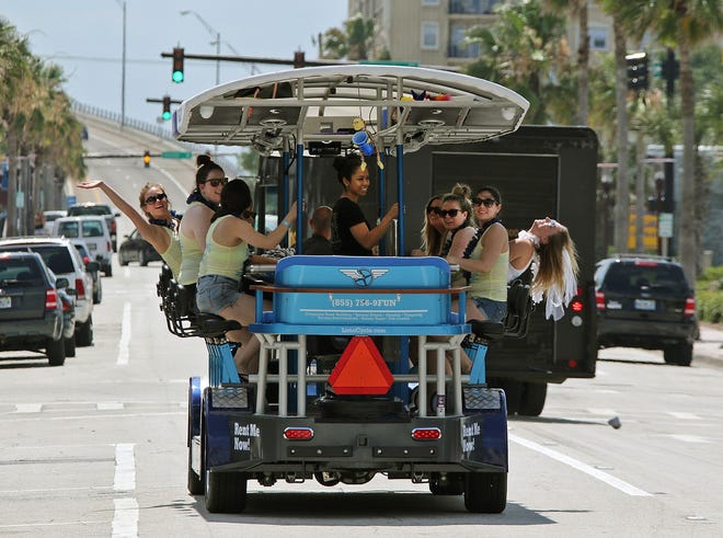 A group of riders pedal a Limo Cycle around the streets of Daytona Beach while celebrating a bachelorette party recently. The tours stop at local bars along the way. Visit news-journalonline.com to watch a video.