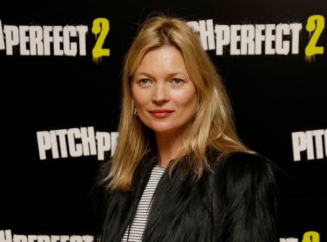 In this Thursday, 30 April, 2015 file photo, Kate Moss poses for photographers at the screening of Pitch Perfect 2 in central London. Supermodel Kate Moss has been escorted off a plane, Sunday June 8, 2015, after reportedly being disruptive while traveling from Turkey to London's Luton airport. (Photo by Joel Ryan/Invision/AP, File)