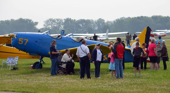 Crowds gathered around planes for the 69th annual Fly-In to Coldwater Airport Sunday. Don Reid photo
