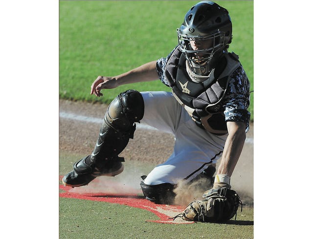Doenges Ford Indian catcher Zac Boyes fields the ball during Monday action against the Ada Braves. Becky Burch/Examiner-Enterprise