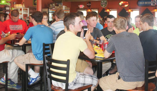 Coldwater's boys baseball team and two track and field players enjoy dinner provided by JT's. Chritsy Hart-Harris Photo