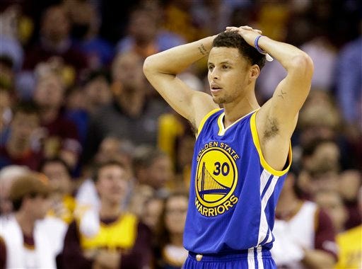 Golden State Warriors guard Stephen Curry (30) watches as the referees check a replay during the second half of Game 3 of basketball's NBA Finals against the Cleveland Cavaliers in Cleveland, Tuesday, June 9, 2015. The Cavaliers defeated the Warriors 96-91. AP Photo/Tony Dejak)