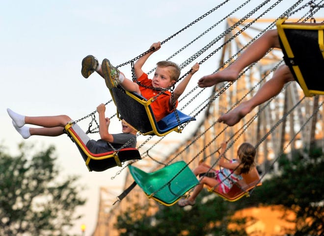 In this Journal Star file photo, kids enjoy the amusement rides at the Steamboat Days Festival.