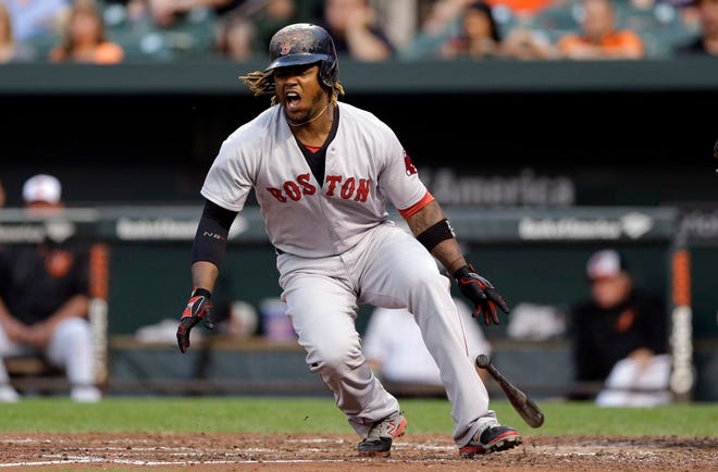 Boston Red Sox's Hanley Ramirez reacts after he was struck by a foul ball during an at-bat in the third inning of a baseball game against the Baltimore Orioles, Tuesday, June 9, 2015, in Baltimore.
