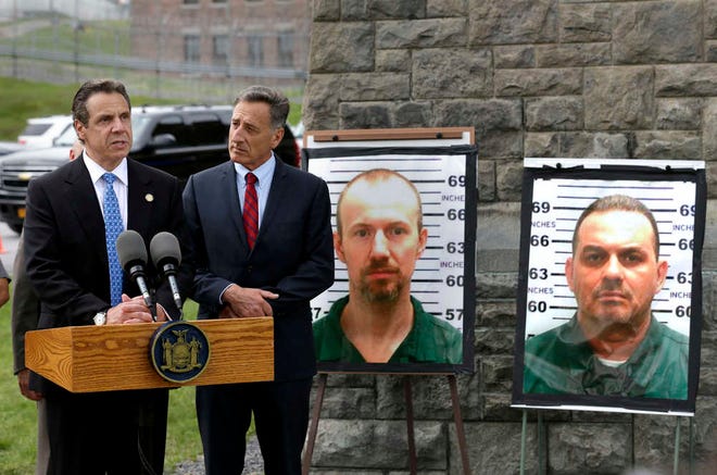 New York Governor Andrew Cuomo, left, speaks while Vermont Governor Peter Shumlin listens during a news conference in front of the Clinton Correctional Facility in Dannemora, N.Y., Wednesday, June 10, 2015. Police were resuming house-to-house searches near the maximum-security prison in northern New York where David Sweat and Richard Matt, two killers escaped using power tools, authorities said Wednesday as they renewed their plea for help from the public. (AP Photo/Seth Wenig)