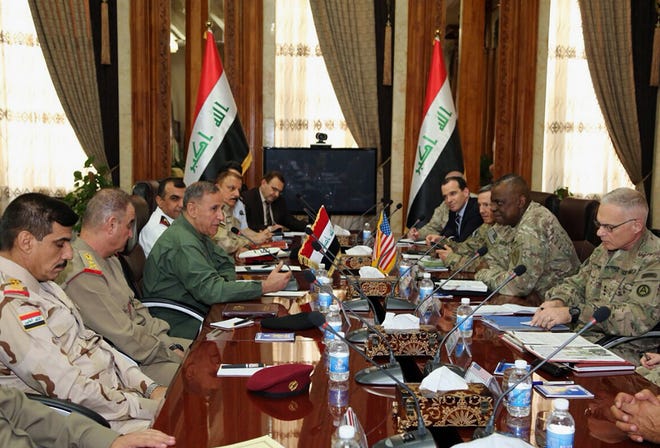 U.S. Army Gen. Lloyd Austin, commander of the U.S. Central Command, second right, meets with Iraq's Defense Minister Khaled al-Obeidi, third left, in Baghdad, Iraq, Wednesday, June 10, 2015.