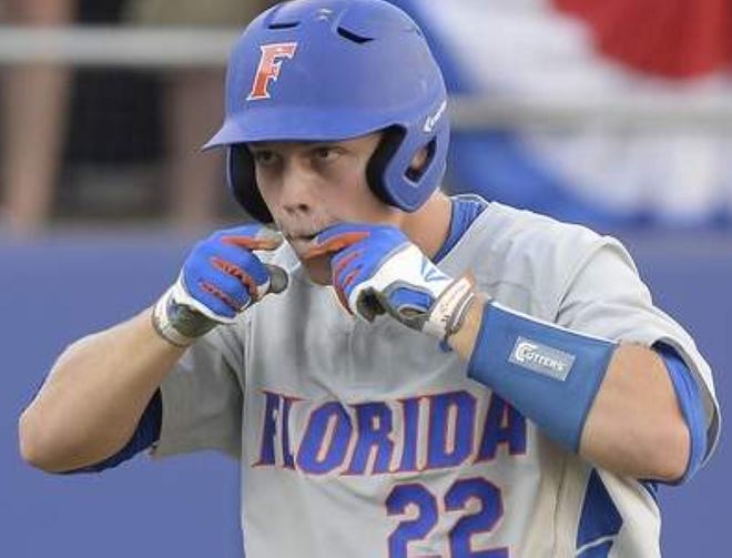 Florida's JJ Schwarz celebrates after his home run during the sixth inning of a super regional game against Florida State on Saturday.