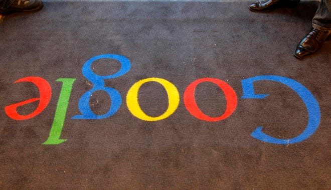 FILE - In this Dec. 6, 2011 file photo, the Google logo is seen on the carpet at Google France offices before its inauguration, in Paris, France. France's data privacy agency ordered Google to remove search results worldwide upon request, giving the company two weeks to apply the "right to be forgotten" globally. The order Friday from CNIL comes more than a year after Europe's highest court ruled that people have the right to control what appears when their name is searched online.(AP Photo/Jacques Brinon, Pool, File)