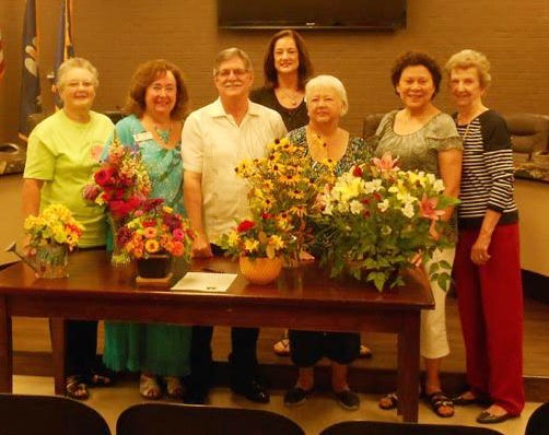 Shown are, from left, Gonzales Garden Club President Priscilla Monson, member Marilyn Rice, Mayor Barney Arceneaux, members Janis Poche and Conchita Richey, GGC Civic Chairman Barbara Guillot, and (back row) member Pat Mouton.