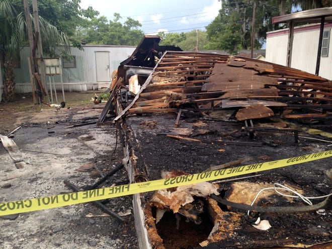 SHASTA KIRKLAND'S MOBILE HOME at 1331 Oakhill St. in Lakeland went up in flames Sunday evening, leaving behind a pile of burnt wood.