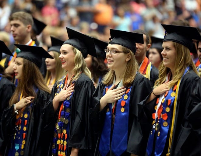 Graduates say the pledge of allegiance during the Lakeland High School commencement on May 30. U.S. News & World Report has ranked Lakeland High among the top 10 percent of high schools in the state.