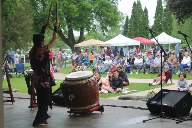 A member of the group Raion Taiko gestures to the crowd during Multicultural Festival in Holland Saturday, June 13, 2015. Curtis Wildfong/Sentinel staff