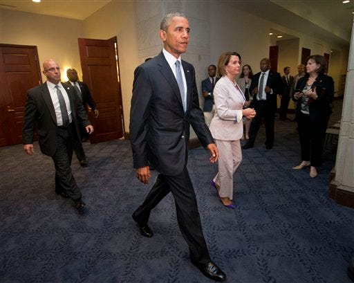 President Barack Obama and House Minority Leader Nancy Pelosi of Calif. leave meeting with House Democrats on Capitol Hill in Washington, Friday, June 12, 2015. The president made an 11th-hour appeal to dubious Democrats on Friday in a tense run-up to a House showdown on legislation to strengthen his hand in global trade talks (AP Photo/Pablo Martinez Monsivais)