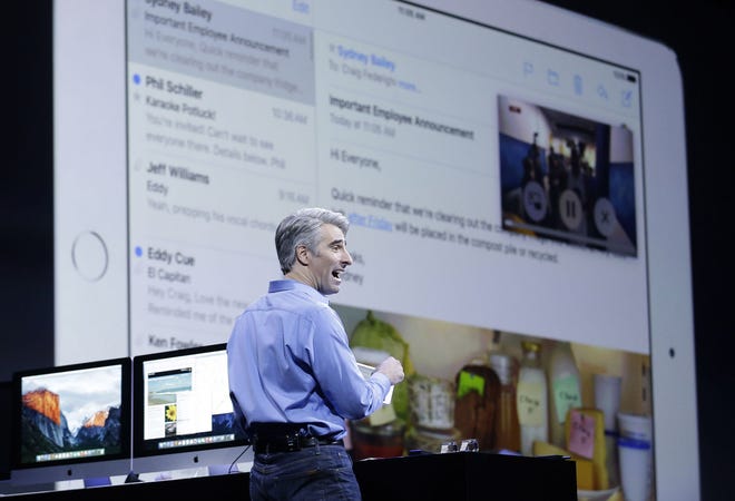 Craig Federighi, Apple senior vice president of software engineering, demonstrates the multitask feature on an iPad at the Apple Worldwide Developers Conference in San Francisco on Monday.