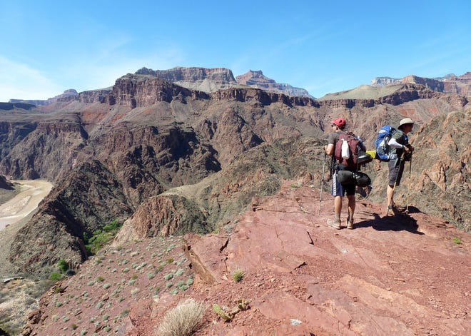 Hikers stop to look at the views near the Grand Canyon National Parkís South Kaibab trail. (AP Photo/Anna Johnson)
