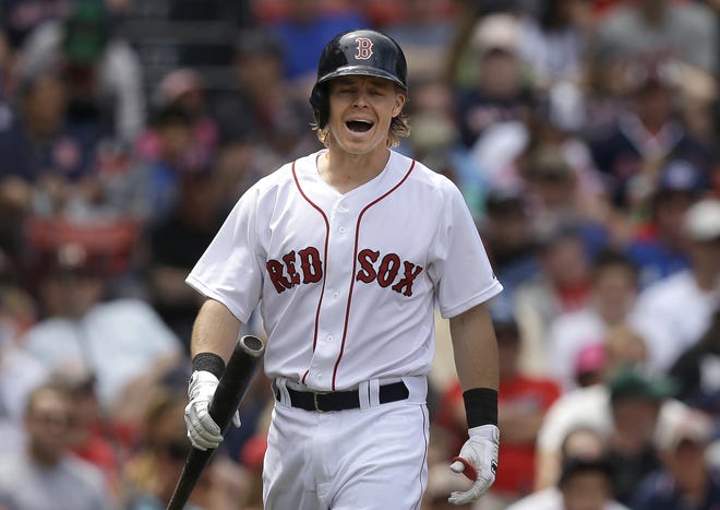 Brock Holt reacts after striking out in the third inning of the Red Sox' 13-5 loss to the Blue Jays on Sunday. It was Boston's sixth straight loss.
