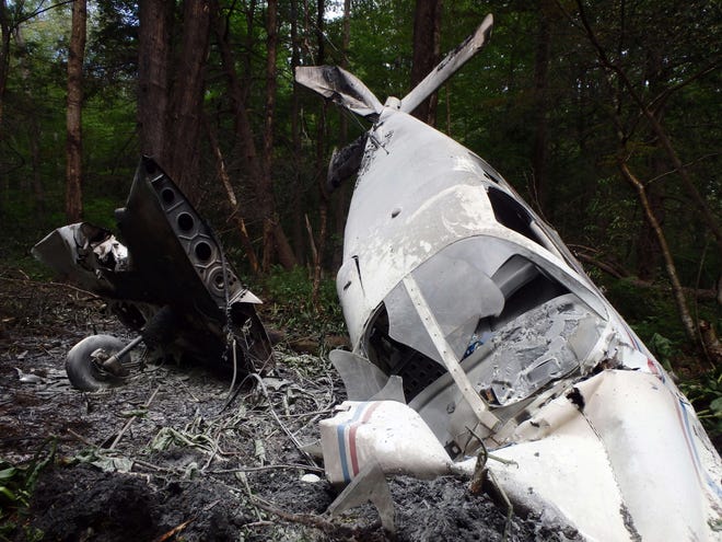 Two people escaped life-threatening injuries after a small plane crashed Sunday morning about 150 yards into the woods north of the Hampton Airfield.

Photo Courtesy of the North Hampton Police Department