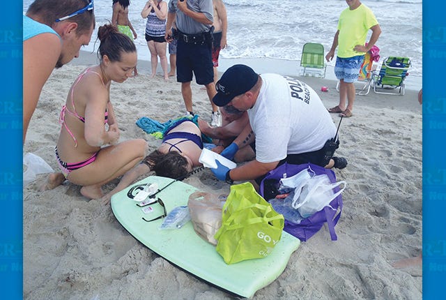 Kiersten Yow (Photo courtesy of Facebook). 
 TIMELY AID — An unidentified police office and a second man tend to Kiersten Yow, a Randolph County girl injured in a shark attack Sunday at Oak Island, N.C. (Photo courtesy Steve Bouser/The Pilot) COMFORTERS — Kiersten Yow, who just completed sixth-grade at Braxton Craven Middle School in Trinity, was airlifted to New Hanover Regional Medical Center in Wilmington following a shark attack on Sunday. (Photo courtesy Steve Bouser/The Pilot)