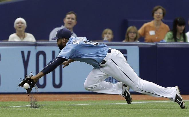 AP Photo/Chris O'Meara Tampa Bay Rays left fielder Joey Butler dives for but cannot make the catch on a double by Chicago White Sox's Melky Cabrera during the sixth inning of a baseball game Sunday, June 14, 2015, in St. Petersburg, Fla.