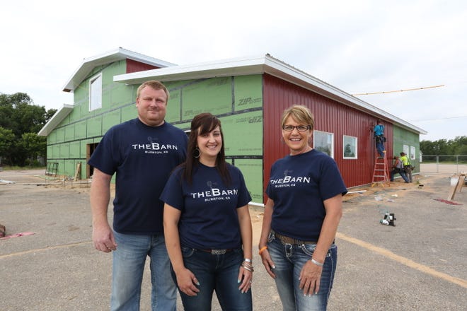 Karl and Lesley Matlack, left, are building a new restaurant in Burrton called ?theBarn? and Shelly Findley, right will be the manager. The restaurant is located on US 50 highway and the Matlacks hope to have it open by mid-September.
