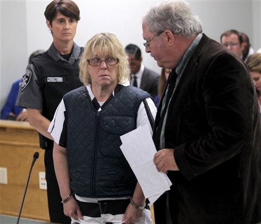 Joyce Mitchell stands with her lawyer, Steven Johnston, appearing before Judge Buck Rogers in Plattsburgh City Court, New York, on Monday. AP (G.N. Miller/NY Post via AP, Pool)