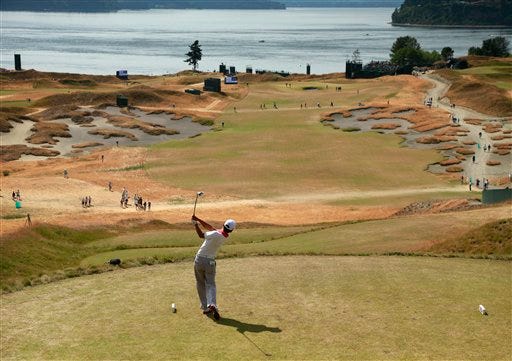 Alex Kim watches his tee shot on the fifth hole during a practice round for the U.S. Open golf tournament at Chambers Bay on Tuesday, June 16, 2015 in University Place, Wash.