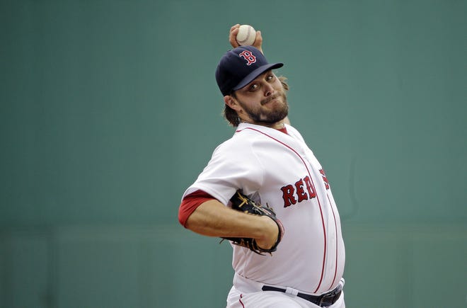 Red Sox starting pitcher Wade Miley delivers to the Braves in the first inning of Tuesday's game at Fenway Park.