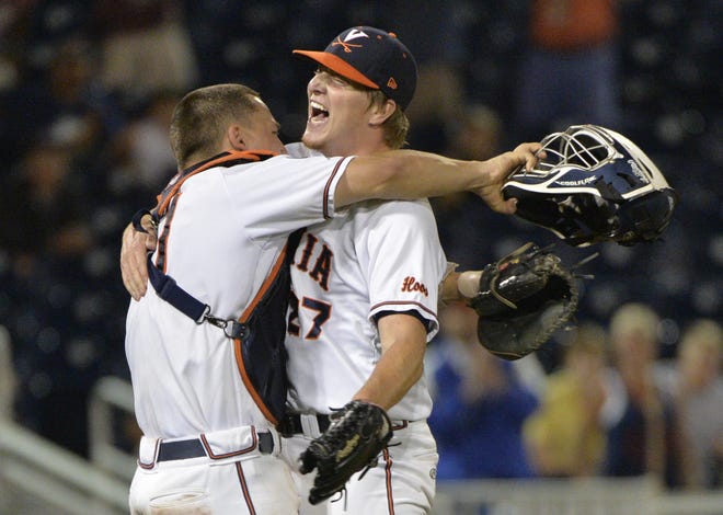 Virginia pitcher Josh Sborz (27) celebrates with catcher Matt Thaiss, left, after a 1-0 win over Florida in an NCAA College World Series baseball game at TD Ameritrade Park in Omaha, Neb., Tuesday, June 16, 2015.