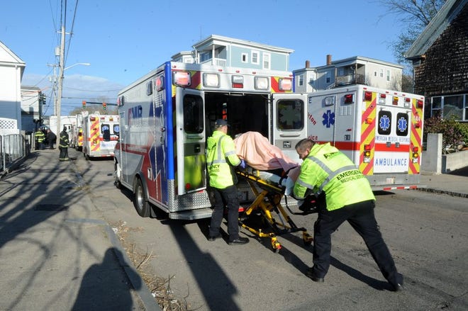 American Medical Response workers loading a patient into an ambulance after Brockton car accident April 24, 2015