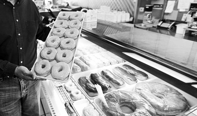 M. Spencer Green/Associated Press Doughnuts are displayed in Chicago. The Obama administration is cracking down on artificial trans fats, calling them a threat to public health. The Food and Drug Administration said Tuesday it will require food companies to phase out the use of artificial trans fats almost entirely.