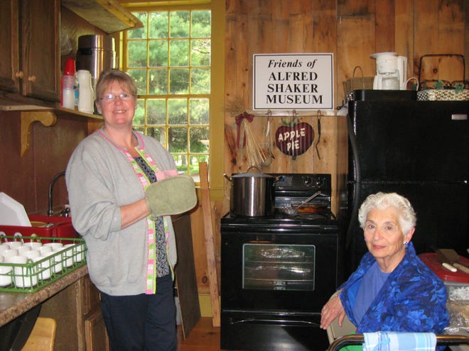 Caterer Jodie Dyer, left, presides over the kitchen and chats with FASM President Barbara Carlson. COURTESY PHOTO