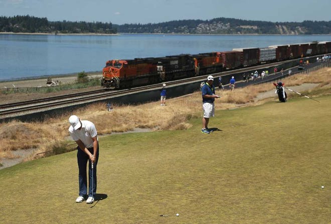 Charlie Riedel Associated Press Jordan Spieth putts as a train goes by on the 16th hole during a practice round for the U.S. Open on Wednesday at Chambers Bay in University Place, Wash.