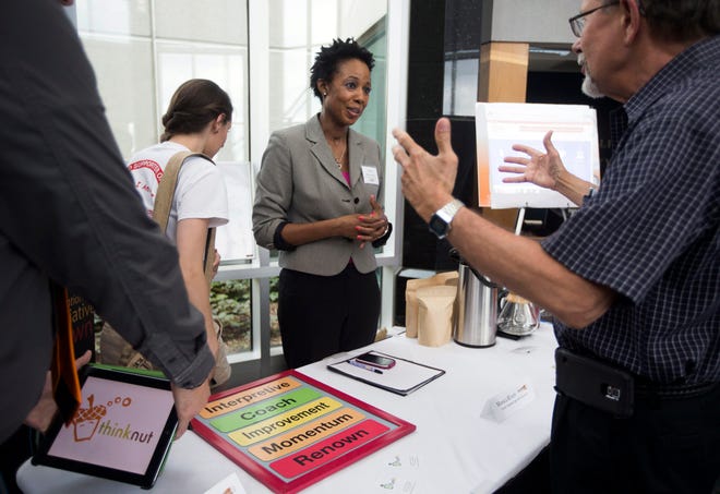 Monica Rivers fields questions on her sales pitch for "Gersher Language App and Head Piece" Wednesday, June 17, 2015, during the ninth annual FastPitch Competition Northern Illinois University-Rockford. SUNNY STRADER/RRSTAR.COM