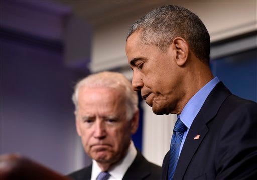 President Barack Obama, accompanied by Vice President Joe Biden, finishes speaking in the Brady Press Briefing Room of the White House in Washington, Thursday, June 18, 2015, on the church shooting in Charleston, S.C., prior to his departure to Los Angeles. (AP Photo/Susan Walsh)