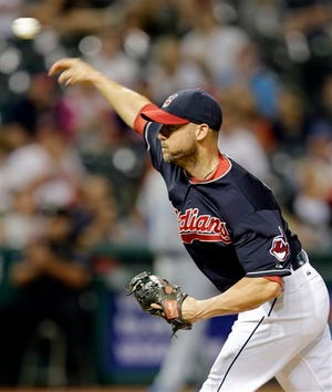 Cleveland Indians relief pitcher Ryan Raburn, who normally plays outfield, delivers in the ninth inning of a baseball game against the Chicago Cubs, Wednesday, June 17, 2015, in Cleveland. The Cubs won 17-0. (AP Photo/Tony Dejak)