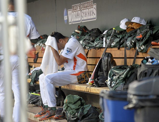 AP Photo/Mike Theiler Miami pitcher Danny Garcia wipes his head in the dugout during an NCAA College World Series baseball elimination game against Florida at TD Ameritrade Park in Omaha, Neb., Wednesday, June 17, 2015.